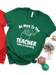 Kids, Be nice to the teacher! Santa is watching! This cute Christmas teacher shirt is the wonderful Christmas teacher gift, Secret Santa gift, or Christmas teacher outfit! Can be made as a tshirt, long sleeve shirt or sweatshirt! Use customization to specify if you'd like it in GREEN or RED! Christmas Teacher Gift, Womens Christmas Shirts, Womens Christmas, Teacher Outfit, Teacher Christmas Gifts, Teacher Tees, Holiday Shirt, Teacher Outfits, Teacher Christmas