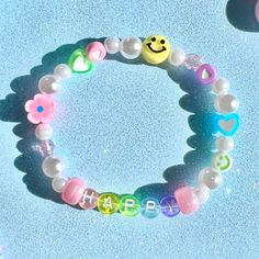 happy bracelet :)  details ❥ approximately 6.5 inches & super stretchy 🐛 ❥ can be adjusted to your sizing :) 🌈 ❥ want this same design but want it to say something else? i can do that 🍄 Trendy Customized Bracelets For Birthday Gift, Trendy Customized Beaded Bracelets For Birthday Gift, Cute Smiley Face Bracelets As Gift, Cute Smiley Face Bracelets For Gift, Cute Smiley Face Bracelet For Gift, Trendy White Bracelets For Birthday Gift, Trendy White Bracelet For Birthday Gift, Trendy Hypoallergenic Stretch Bracelet For Birthday, Trendy Adjustable Beaded Bracelets For Birthday Gift