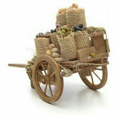 an old wooden cart filled with lots of stuff