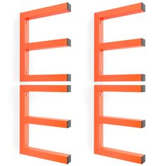 three orange shelfs with metal brackets on them