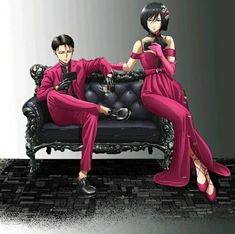 two people sitting on a black couch in pink outfits