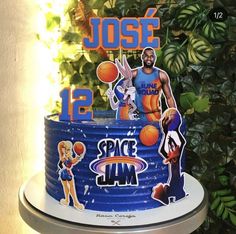 a birthday cake with an image of the basketball player and his name is space jam