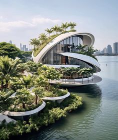 an architecturally designed house on the water with palm trees and other greenery around it