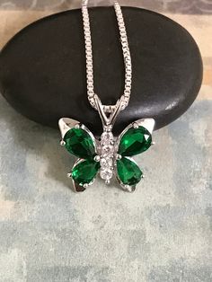 Sterling Silver Emerald CZ Butterfly Necklace Emerald is the birthstone for May. This makes a perfect gift for those loved ones born in May. Metal: All components are made from solid .925 Sterling Silver Stone: Cubic Zirconia Measurement: pendant height is 18mm including bail and 17mm at widest part Choose Chain Length At Checkout You can find other CZ and Birthstone Jewelry in my shop here https://www.etsy.com/shop/LinksAndStones?ref=seller-platform-mcnav&section_id=24399452 Please feel fre Silver Oval Birthstone Necklace Gift, Oval Silver Birthstone Necklace Gift, Nickel-free May Birthstone Necklace For Birthday, Sterling Silver Hypoallergenic May Birthstone Necklace, Cubic Zirconia Pendant Jewelry For Birthdays, May Birthstone Necklace With Cubic Zirconia, May Birthstone Jewelry Gift With Stones, Birthday Cubic Zirconia Pendant Jewelry, Hypoallergenic Sterling Silver May Birthstone Necklace