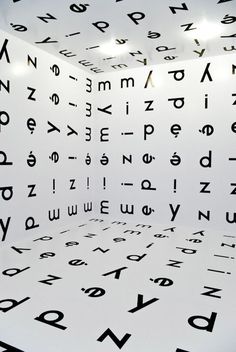 the room is filled with letters and numbers on the wall, as well as lights