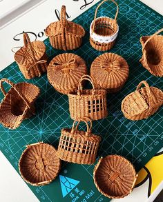 wicker baskets sitting on top of a cutting board next to scissors and other items