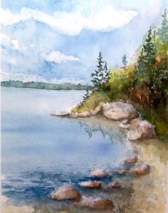 a watercolor painting of a lake with rocks on the shore and trees in the background