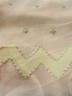 the fabric has pink flowers on it