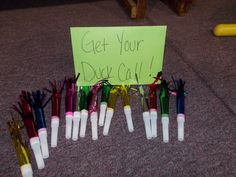 a sign that says get your duck call surrounded by many different colored pens and wires