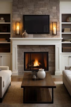 a living room filled with furniture and a flat screen tv mounted above a fire place