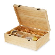 an open wooden box with two glasses and some food in it on a white background