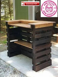 an outdoor table made out of pallets and wooden crates on the concrete with one section open