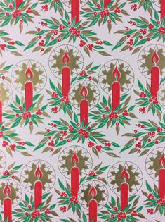 a christmas pattern with candles and holly leaves on a white wallpaper background in red, green and gold colors