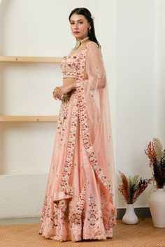 Soft pink lehenga with resham, mirror and sequin embroidery. Comes with blouse and dupatta.
Component: 3
Pattern: Embroidery
Type Of Work: Mirror, Sequin, Resham and Pearl
Neckline: Sweetheart
Sleeve Type: Half
Fabric: Pure Silk and Net; Lining: Shantoon
Color: Pink
Other Details: 
Dupatta with embroidered and cutwork border
Low back with tie up
Occasion: Bride - Aza Fashions Embroidery Mirror, Pink Lehenga, Pink Mirror, Sequin Embroidery, Sanya, Silk Lehenga, Pattern Embroidery, Sequins Embroidery, Bridal Lehenga