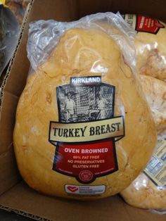 turkey breast is wrapped in plastic and ready to be sold at the store or take out