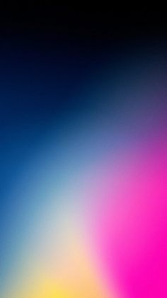 a blurry image of an orange, pink and blue background