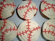 six cupcakes with white frosting and red sprinkles on them