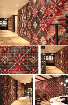 the interior of a restaurant with red and black wallpaper