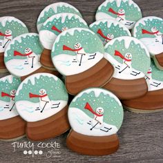 decorated cookies with snowmen and skis on them