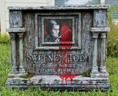 an old tombstone with blood dripping down the side and a painting on it's face