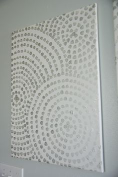 a white wall hanging on the side of a building