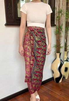 Pink Gold Ethnic Bali Batik Wrap Skirt HOW TO STYLE: This is instant wrap skirt, very easy to style.  You can wear this batik wrap skirt from day to night, as a beach cover up or style it with a top for a formal event. You can even turn this skirt into a beautiful dress.  Perfect for Bridesmaid Gift, Valentine's Day Gift, Mother's Day Gift, Birthday Gift for Her. MATERIALS: Cotton Batik  Batik handcrafted in Bali Self Manufactured  Size inclusive❗️Contact us for custom size ✅ MEASUREMENTS: Size: Traditional Beach Skirt, Traditional Skirt Bottoms For Beach, Traditional Skirt For Beach, Traditional Long Skirt For The Beach, Traditional Long Skirt For Beach, Traditional Long Beach Skirt, Bohemian Multicolor Wrap Sarong, Multicolor Bohemian Wrap Sarong, Red Bohemian Sarong For Vacation