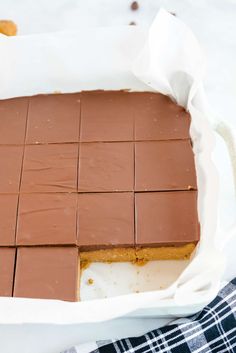 a pan filled with chocolate squares on top of a table