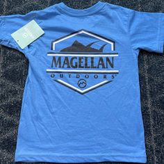 Nwt Kids Xl (6-7) Magellan Short Sleeve Tshirt. Carolina Blue. Magellan On Front Left Chest And Logo Is In Navy And Takes Up The Entire Back Of The Shirt. I Have Several Available! Blue Cotton Tops For Outdoor, Blue Graphic Tee For Outdoor Activities, Outdoor Blue Cotton Tops, Blue Crew Neck Top For Outdoor Activities, Blue Crew Neck Shirt For Outdoor, Blue Graphic Print Top For Outdoor, Blue Cotton Outdoor T-shirt, Outdoor Blue Cotton T-shirt, Blue Cotton T-shirt For Outdoor Activities