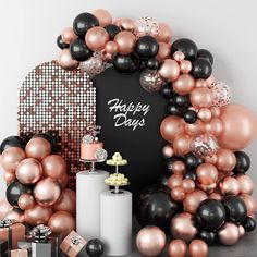 a birthday party with black, pink and gold balloons