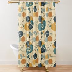 an abstract shower curtain with circles and dots on it in yellow, blue, orange and green colors