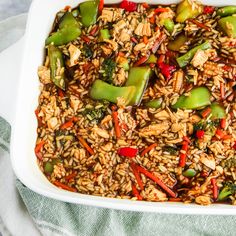 a casserole dish filled with rice and vegetables