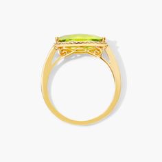 a yellow gold ring with an oval cut stone