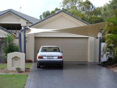 a car is parked in front of a house