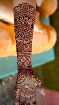 a woman's hand with henna on it