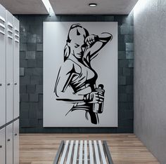 a black and white drawing of a woman holding a bottle in an industrial style hallway