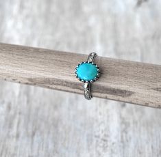 American Turquoise in Sterling Silver - Handcrafted Artisan Silver Ring ● 10x8 mm American Turquoise (stabilized) ● 3 mm Sterling Silver band Please allow 3-4 business days for your ring to be made to order in your size. Gift box available. Ring Sizer: If you do not know your RING SIZE, you can purchase a ring sizer from my shop here: http://www.etsy.com/listing/127527482/ring-sizer Other Rings: http://www.etsy.com/shop/PrairieCoastArt?section_id=13276453 SHOP HOME: http://www.etsy.com/shop/Prai Adjustable Turquoise Oval Rings, Artisan Adjustable Turquoise Ring For Anniversary, Oval Turquoise Promise Ring, Turquoise Ring With Accent Stones As Gift, Southwestern Style Turquoise Ring Gift, Handmade Adjustable Oval Turquoise Ring, Gift Turquoise Ring With Accent Stones, Handmade Adjustable Turquoise Ring For Anniversary, Handmade Turquoise Jewelry For Promise Ring