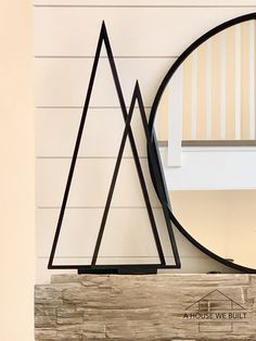 a mirror sitting on top of a wooden shelf