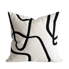 a white pillow with black lines on it