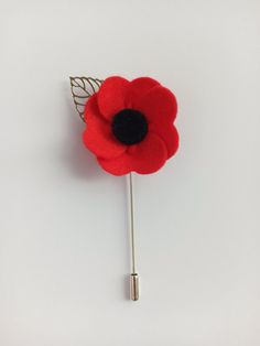 Remembrance Poppy Flower Brooch The term of shipping to the USA is 8-11 days These brooches are made from 1 layer of red felt with a black velvet center. This poppy measures approximately 3.7'' (9.5 cm) length and 1.7'' (4 cm) wide. Flower is fitted with a stick pin and a leaf. Do not wet. Only for inside wear. Delicate care. Be sure that you have enough time to get your order Approximate terms of shipping: Europe: 1-3 weeks Canada 2-4 weeks Australia, New Zealand and Oceania: 3-5 weeks We'll do Handmade Red Flower Brooches, Red Handmade Flower Brooches, Red Flower-shaped Brooch With Handmade Flowers, Red Anemone Flower, Poppy Pins, Remembrance Day Poppy, Red Anemone, Remembrance Poppy, Boutonniere Pins