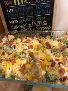 a casserole dish with broccoli, cheese and bacon on it in a glass pan