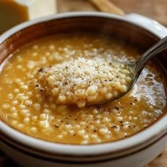 a spoon with some food in it on a table