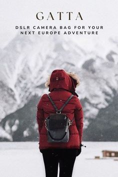 a person with a backpack standing in front of snow covered mountains and the caption reads, gatta dslr camera bag for your next europe adventure