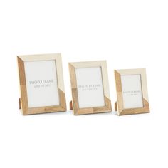 three wooden frames sitting next to each other