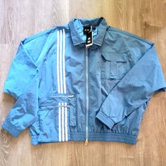 Adidas Originals Ivy Park Lite Blue Nylon *Unisex* Track Jacket Men's/Women's Xl Style #: H33303 Condition: Brand New With Tags Ready To Be Shipped. Please Feel Free To Message Me If Additional Photos Are Needed. **All Items Shipped The Same Day!!*** Blue Relaxed Fit Outerwear For Outdoor, Urban Blue Nylon Outerwear, Relaxed Fit Sportswear Outerwear For Spring, Blue Relaxed Fit Athleisure Outerwear, Blue Sportswear Outerwear For Spring, Sporty Track Jacket With Pockets For Spring, Blue Spring Sportswear Outerwear, Blue Nylon Windbreaker With Pockets, Blue Sporty Outerwear With Relaxed Fit