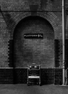 an old brick building with a sign that says platform 9