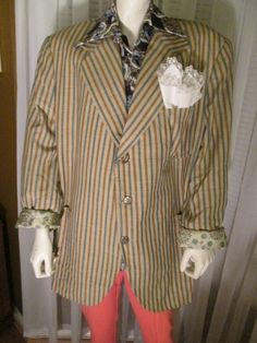 "Cool stripes of blue, tan, brown, with large 9 1/2\" by 8\" front bottom pockets, and 6\" by 6\" top left front pocket for your hankie. Each sleeve at bottom has 2 small gold-tone metal buttons on end, and jacket front has 3 medium size gold-tone closure buttons. Inside of jacket has 3 pockets and a beautiful abstract silk-like lining in cream, gold , black print. Jacket is in excellent condition Chest 44\", Sleeves 25', Length 32\", Shoulder 20\". PRICE is $75.00Sale Final/As Is." Vintage Brown Blazer With Patch Pockets, Vintage Brown Cotton Blazer, Retro Brown Sport Coat With Pockets, Brown Retro Sport Coat With Pockets, Vintage Brown Blazer With Pockets, Brown Vintage Blazer With Pockets, Retro Brown Blazer With Pockets, 1970s Men, Striped Jacket