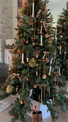 a decorated christmas tree with ribbons and ornaments