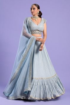 Ice blue crepe pleated lehenga with all over sequin and zari work. Paired with plunged V neck padded blouse with booti pattern mirror, sequin, zari embroidery and organza dupatta.
Components:3
Pattern:Embroidered
Type of Work:Mirror, Sequin and Zari Work
Neckline:Plunged V Neck
Sleeve Type:Cap Sleeves
Fabric:Lehenga: Crepe, Blouse: Net, Dupatta: Organza
Color:Blue
Other Details:
Embroidered border on dupatta
Embroidered waistband on blouse
Deep V back
Closure:
Lehenga: Side tie-up
Blouse: Back h Lehenga Blue, Tiered Lehenga, Hand Work Blouse, Hand Work Blouse Design, Blue Mirror, Organza Dupatta, Chaniya Choli, Lehenga Designs, Two Sisters