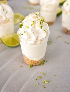 small desserts with whipped cream, lime and graham crackers on a table top