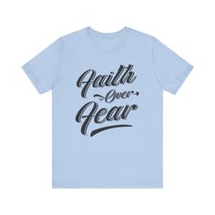 This classic unisex 'Faith Over Fear' jersey short sleeve tee offers the comfort of a well-loved favorite. Crafted from soft cotton with a high-quality print, this shirt is one you'll reach for again and again. It features ribbed knit collars for enhanced shape retention and tapered shoulders for a fit that improves over time. Dual side seams ensure lasting durability, keeping the tee in shape longer. Ideal for both active and leisure wear, it provides a versatile retail fit that suits casual and semi-formal occasions. The crew neckline adds a timeless, polished touch, perfect for pairing with your favorite accessories. Product Details: .: Made with 100% Airlume combed and ring-spun cotton, a lightweight fabric (4.2 oz/yd² (142 g/m²)) that is easy to layer, breathable. .: Bella+Canvas manu Relaxed Fit Short Sleeve T-shirt With Lettering, Relaxed Fit T-shirt With Lettering, Short Sleeve, Relaxed Fit T-shirt With Lettering, Relaxed Fit Short Sleeve Shirt With Lettering, Blue Graphic Tee With Lettering, Inspirational Short Sleeve Streetwear T-shirt, Inspirational Short Sleeve T-shirt For Streetwear, Blue Short Sleeve T-shirt With Lettering, Blue Short Sleeve Tops With Lettering